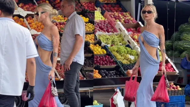 Niet bepaald het handigste jurkje om boodschappen in te doen